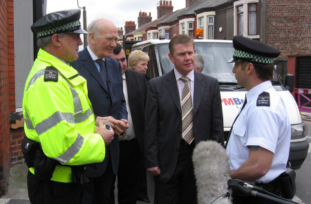 Ming Campbell meeting police officers in Liverpool, with council leader Warren Bradley